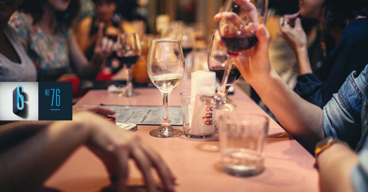 Table with wine glasses on it