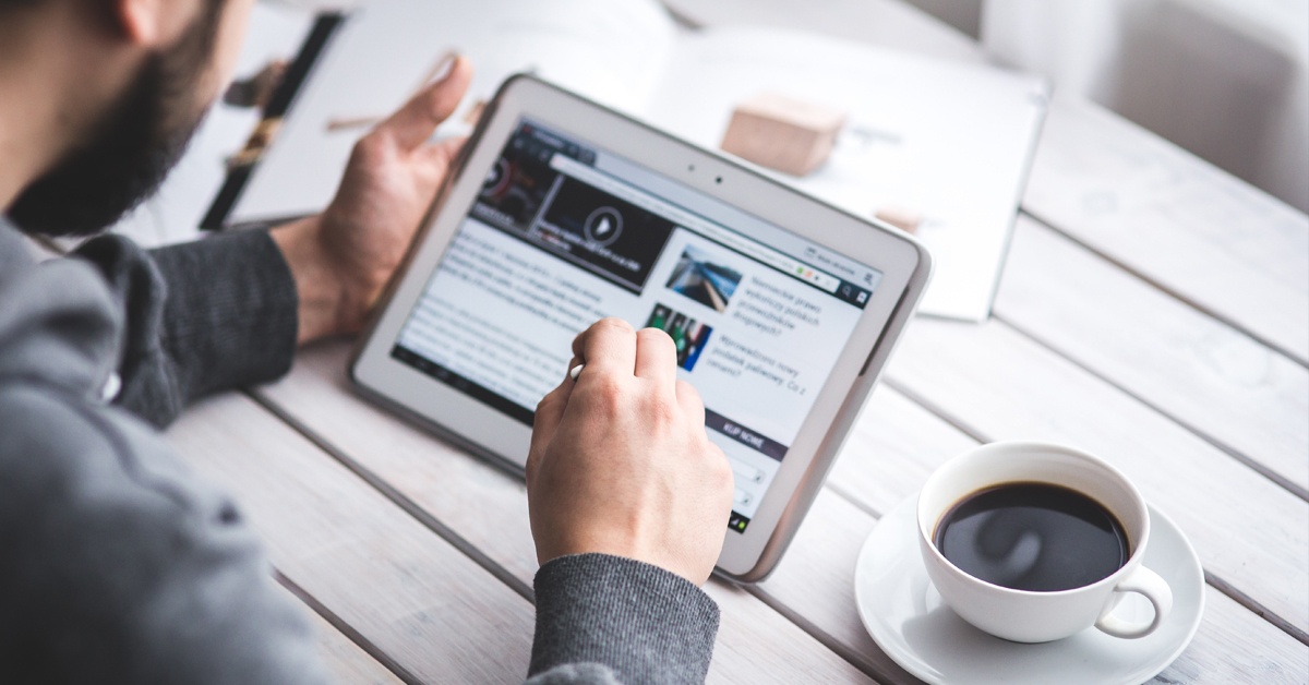 Man browsing web on a tablet