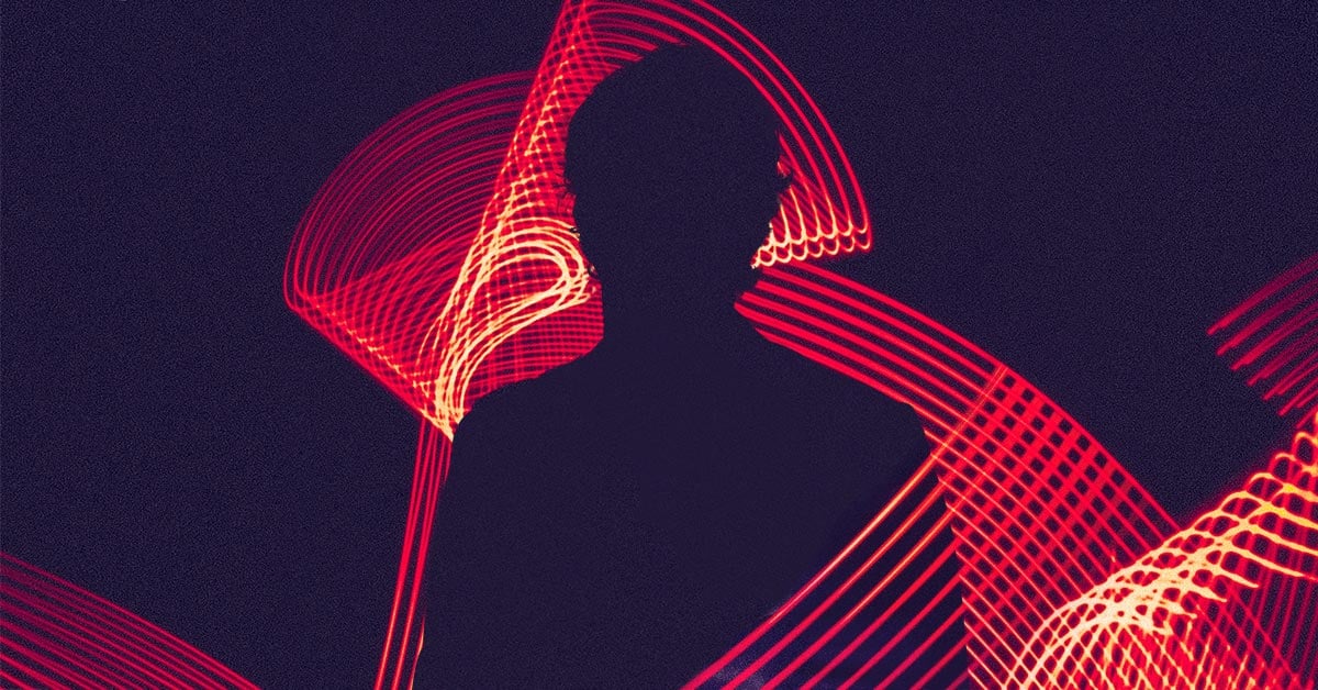 silhouette of a man in abstract lights