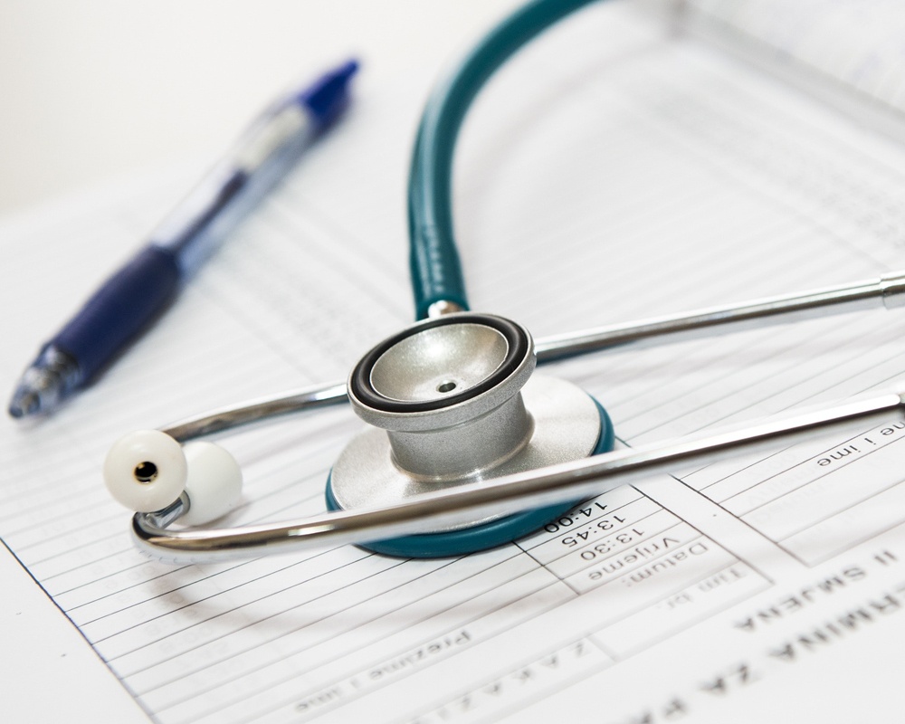 Stethoscope on medical records