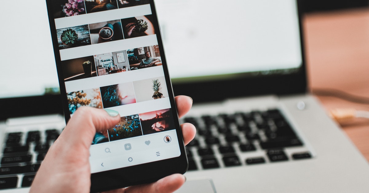 Woman scrolling through photos on a smartphone