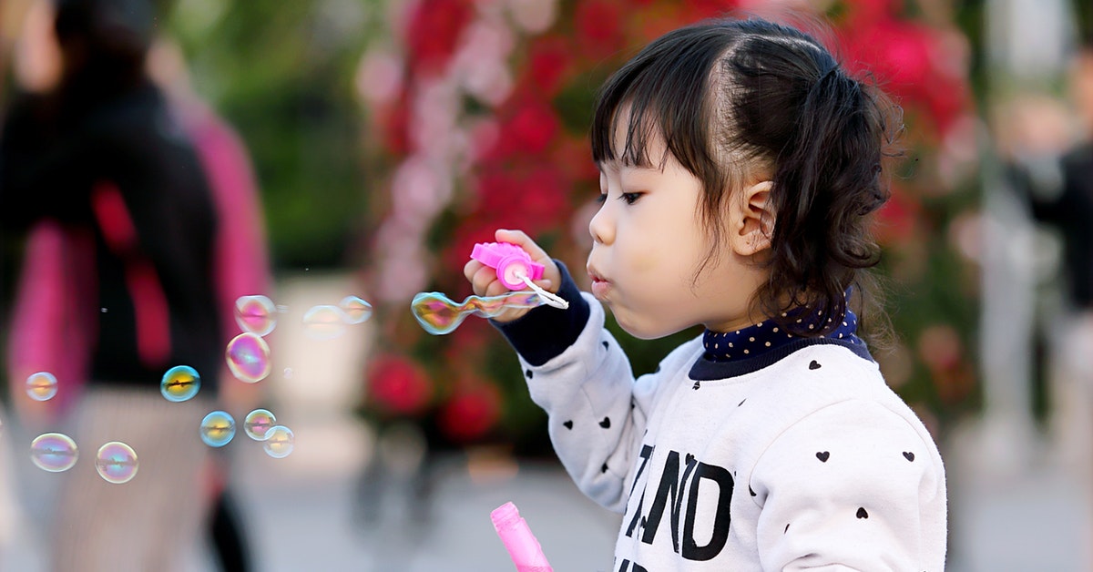 A child blowing bubbles