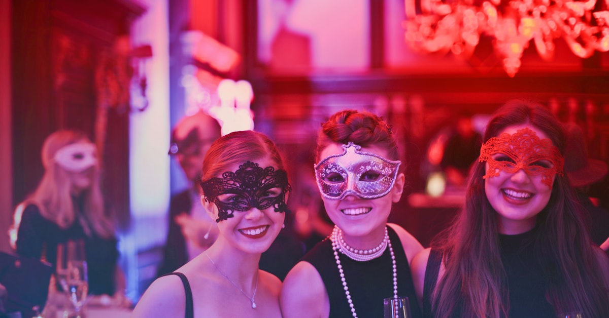 Women at Marti Gras themed party 