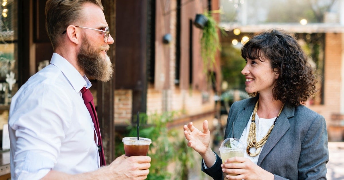 Adults talking over coffee